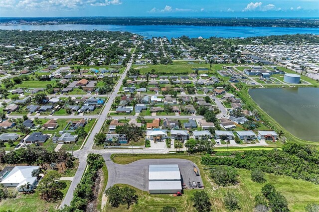 2406 15th St W, Palmetto, FL 34221 - aerial view of property and surrounding area featuring nearby suburban area and a nearby body of water