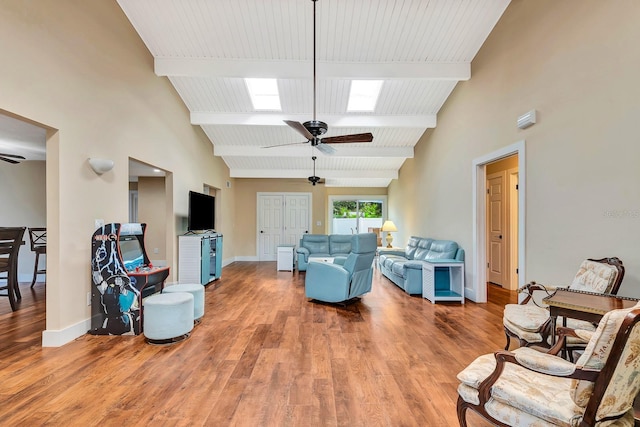 2315 Riverwood Pines Dr, Sarasota, FL 34231 - living area with ceiling fan, beamed ceiling, wood finished floors, and high vaulted ceiling