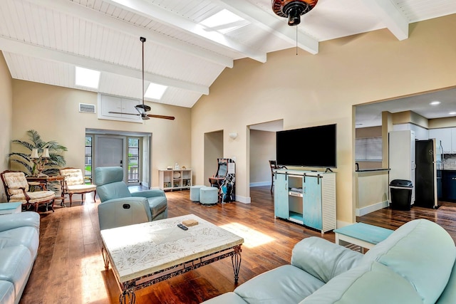 2315 Riverwood Pines Dr, Sarasota, FL 34231 - living area with a ceiling fan, beamed ceiling, high vaulted ceiling, wood finished floors, and a skylight