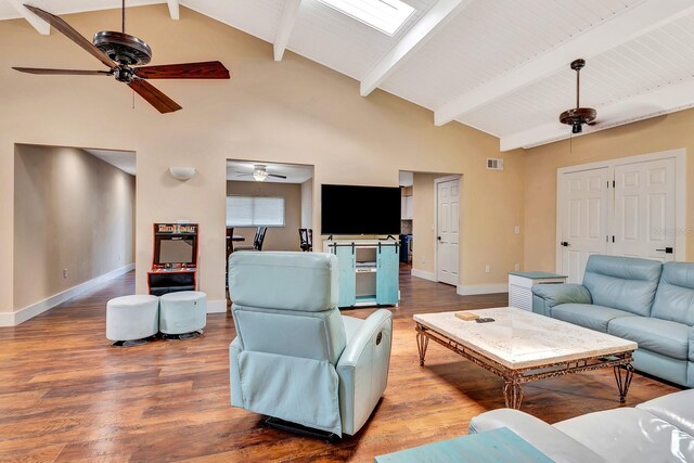 2315 Riverwood Pines Dr, Sarasota, FL 34231 - living area featuring ceiling fan, wood finished floors, beam ceiling, and high vaulted ceiling