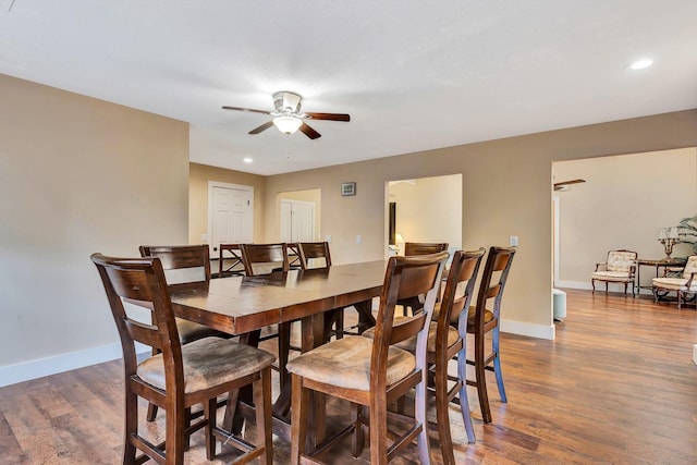 2315 Riverwood Pines Dr, Sarasota, FL 34231 - dining area with ceiling fan, wood finished floors, and recessed lighting