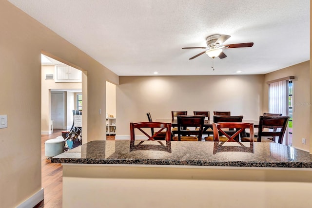 2315 Riverwood Pines Dr, Sarasota, FL 34231 - dining space featuring a ceiling fan, wood finished floors, and recessed lighting
