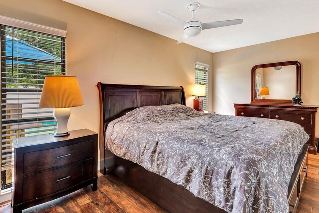 2315 Riverwood Pines Dr, Sarasota, FL 34231 - bedroom featuring dark wood-type flooring and a ceiling fan