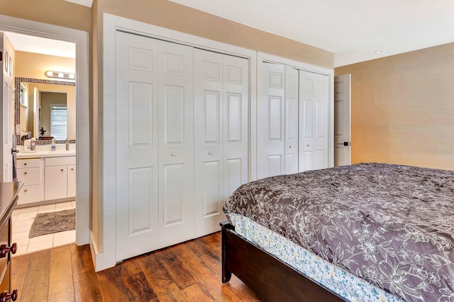 2315 Riverwood Pines Dr, Sarasota, FL 34231 - bedroom with wood finished floors and two closets