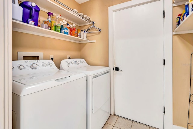 2315 Riverwood Pines Dr, Sarasota, FL 34231 - washroom with independent washer and dryer and light tile patterned floors