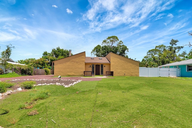 2315 Riverwood Pines Dr, Sarasota, FL 34231 - rear view of property featuring stucco siding