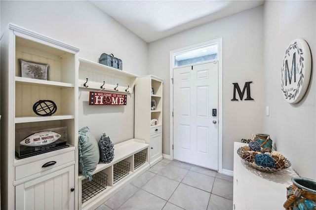 8979 Milestone Dr, Sarasota, FL 34238 - mudroom featuring light tile patterned floors