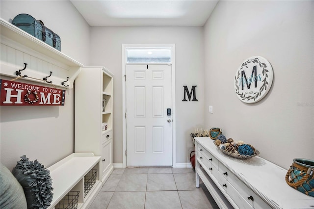 8979 Milestone Dr, Sarasota, FL 34238 - mudroom with light tile patterned floors and baseboards