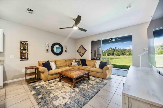 8979 Milestone Dr, Sarasota, FL 34238 - living area with ceiling fan and light tile patterned floors