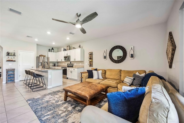 8979 Milestone Dr, Sarasota, FL 34238 - living room with ceiling fan, light tile patterned floors, and recessed lighting