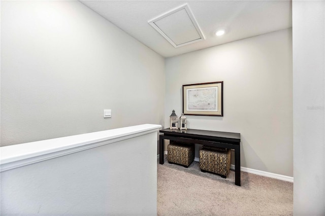 8979 Milestone Dr, Sarasota, FL 34238 - hallway with light colored carpet, attic access, and recessed lighting