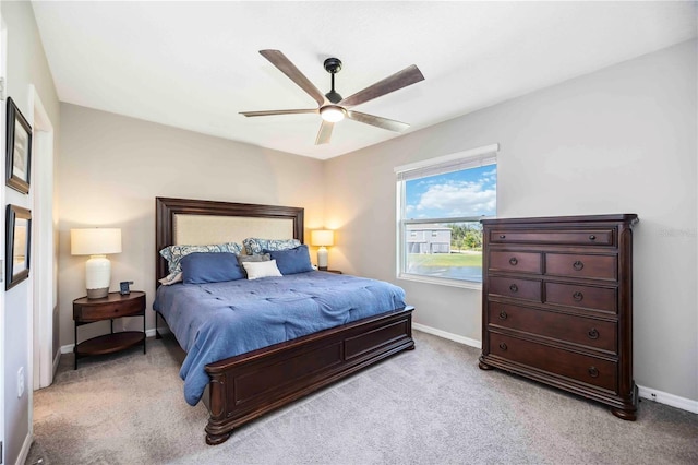 8979 Milestone Dr, Sarasota, FL 34238 - bedroom with light colored carpet and a ceiling fan