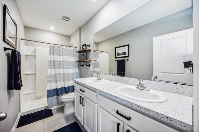 8979 Milestone Dr, Sarasota, FL 34238 - bathroom featuring double vanity, a shower with curtain, and tile patterned floors