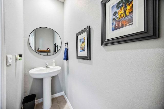 8979 Milestone Dr, Sarasota, FL 34238 - bathroom featuring tile patterned flooring and baseboards
