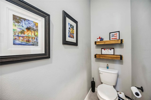 8979 Milestone Dr, Sarasota, FL 34238 - half bathroom with toilet and tile patterned flooring