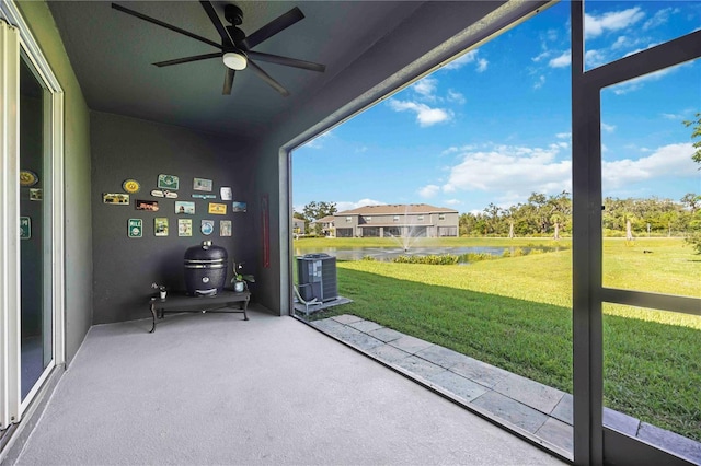 8979 Milestone Dr, Sarasota, FL 34238 - sunroom with ceiling fan and a water view