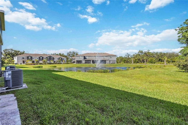 8979 Milestone Dr, Sarasota, FL 34238 - view of grassy yard featuring a water view and a residential view