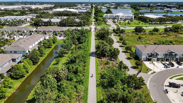 8979 Milestone Dr, Sarasota, FL 34238 - aerial perspective of suburban area with a large body of water and a tree filled landscape