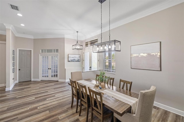 8840 Brookfield Ter, Bradenton, FL 34212 - dining area featuring french doors, ornamental molding, wood finished floors, and recessed lighting