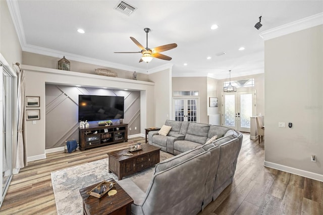 8840 Brookfield Ter, Bradenton, FL 34212 - living area with a ceiling fan, wood finished floors, french doors, ornamental molding, and recessed lighting