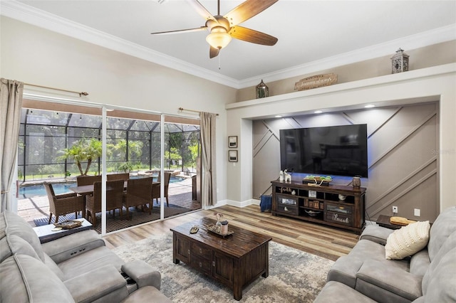 8840 Brookfield Ter, Bradenton, FL 34212 - living area featuring ornamental molding, a ceiling fan, and wood finished floors