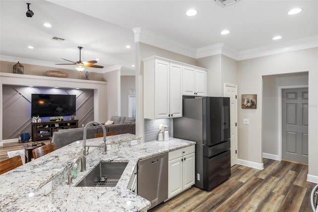8840 Brookfield Ter, Bradenton, FL 34212 - kitchen with dishwasher, freestanding refrigerator, light stone countertops, open floor plan, and recessed lighting