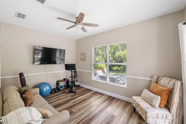 8840 Brookfield Ter, Bradenton, FL 34212 - living area featuring a ceiling fan and wood finished floors