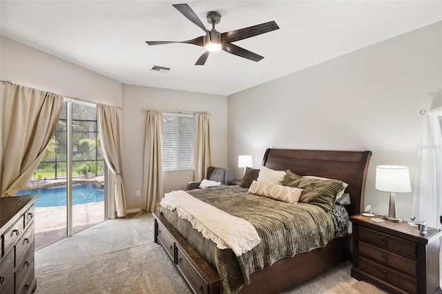 8840 Brookfield Ter, Bradenton, FL 34212 - bedroom with access to exterior, light colored carpet, and ceiling fan