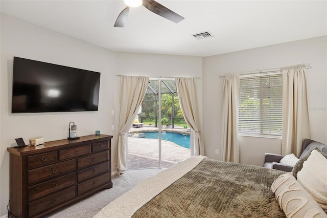 8840 Brookfield Ter, Bradenton, FL 34212 - bedroom with access to exterior, light carpet, and a ceiling fan