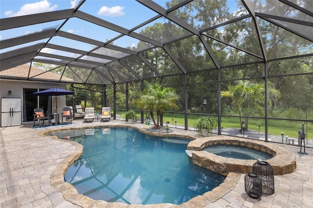 8840 Brookfield Ter, Bradenton, FL 34212 - view of pool featuring a patio, a pool with connected hot tub, and glass enclosure