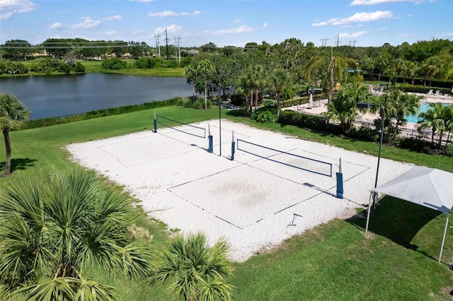 8840 Brookfield Ter, Bradenton, FL 34212 - view of community featuring volleyball court, a water view, a lawn, and view of scattered trees