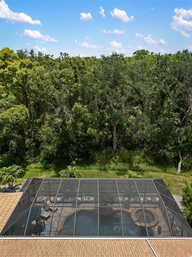 8840 Brookfield Ter, Bradenton, FL 34212 - view of swimming pool featuring a lanai and a view of trees