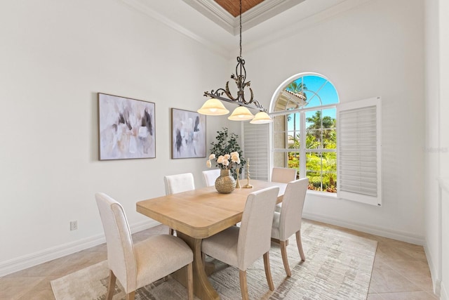 7144 Ashland Gln, Lakewood Ranch, FL 34202 - dining room featuring light tile patterned floors, crown molding, and a towering ceiling
