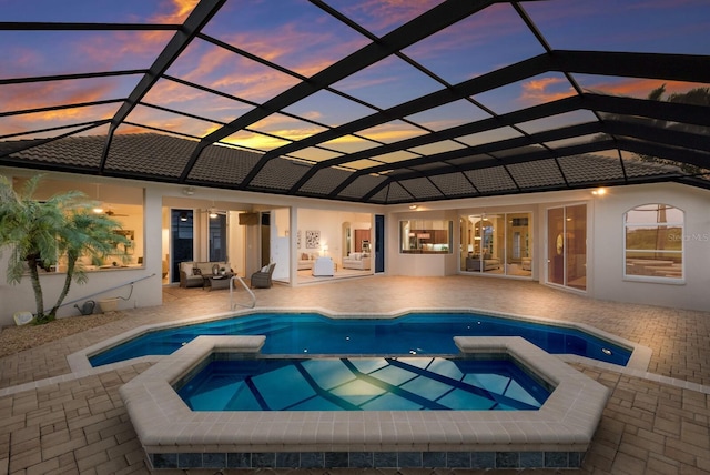 7144 Ashland Gln, Lakewood Ranch, FL 34202 - view of pool featuring a pool with connected hot tub, a patio, an outdoor hangout area, and a lanai