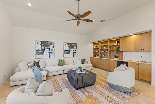 7144 Ashland Gln, Lakewood Ranch, FL 34202 - living area with light tile patterned flooring, ceiling fan, recessed lighting, high vaulted ceiling, and bar