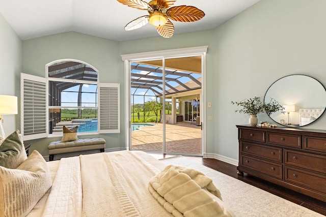 7144 Ashland Gln, Lakewood Ranch, FL 34202 - bedroom with access to outside, vaulted ceiling, dark wood-style flooring, and a sunroom