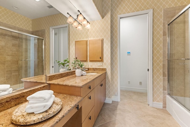 7144 Ashland Gln, Lakewood Ranch, FL 34202 - full bath with vanity, wallpapered walls, tile patterned flooring, and tiled shower / bath