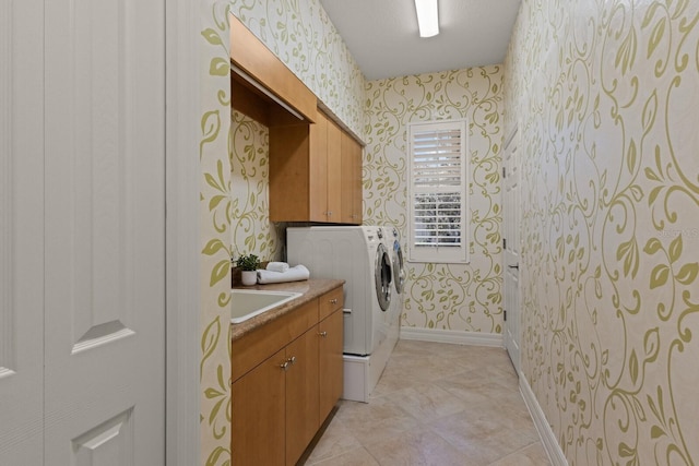 7144 Ashland Gln, Lakewood Ranch, FL 34202 - laundry area with wallpapered walls, washer and dryer, and cabinet space