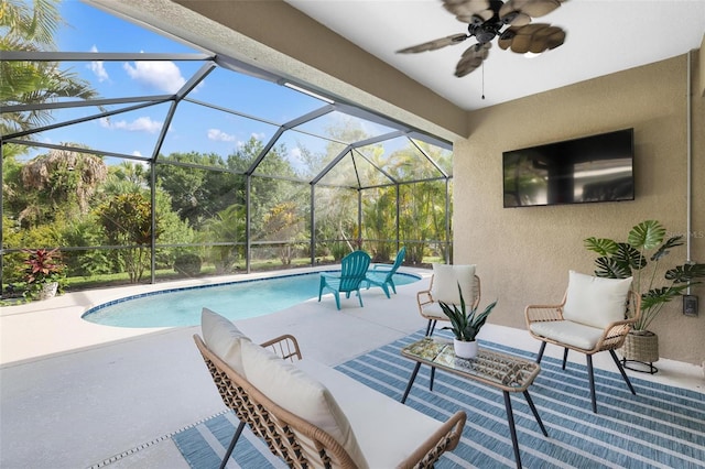 12261 Stuart Dr, Venice, FL 34293 - outdoor pool with a patio area, an outdoor living space, a ceiling fan, and a lanai