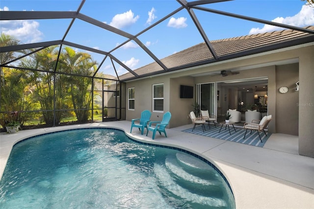 12261 Stuart Dr, Venice, FL 34293 - swimming pool featuring a patio area, ceiling fan, and a lanai