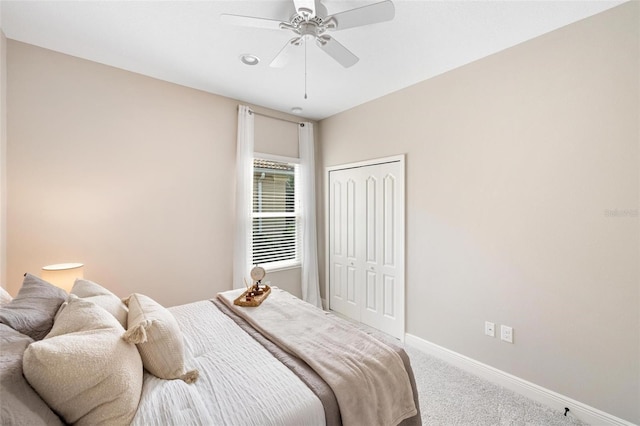 12261 Stuart Dr, Venice, FL 34293 - bedroom featuring carpet floors, a closet, and a ceiling fan