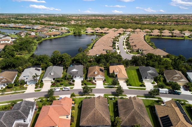 12261 Stuart Dr, Venice, FL 34293 - aerial view of property's location with nearby suburban area and a nearby body of water