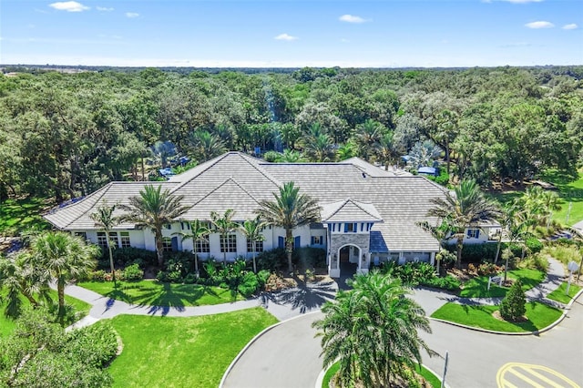 12261 Stuart Dr, Venice, FL 34293 - view of front of house with a forest view and stucco siding