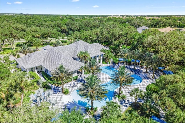 12261 Stuart Dr, Venice, FL 34293 - view from above of property with a heavily wooded area and a pool