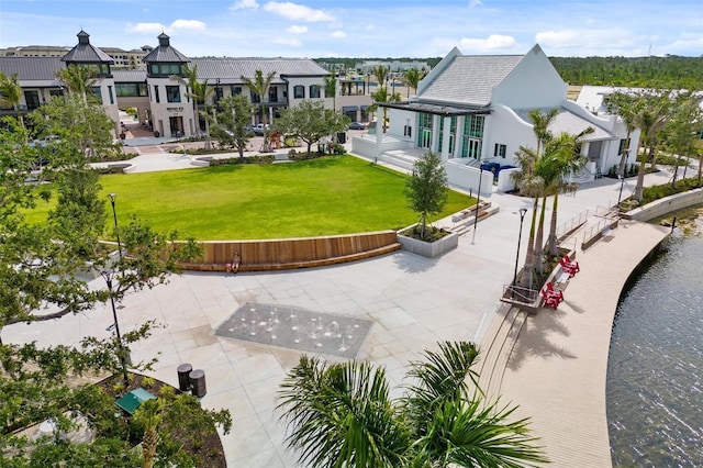 12261 Stuart Dr, Venice, FL 34293 - surrounding community with a lawn, a water view, and a residential view