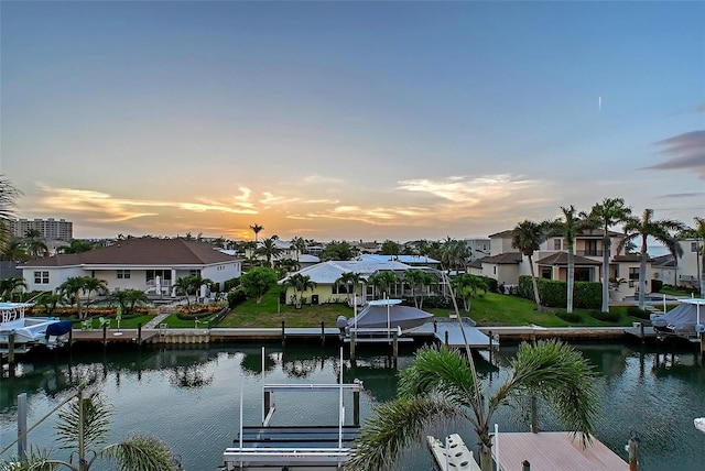 571 Birdie Ln, Longboat Key, FL 34228 - dock area with a water view and a residential view