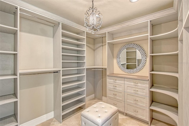 571 Birdie Ln, Longboat Key, FL 34228 - spacious closet featuring a chandelier and light tile patterned flooring