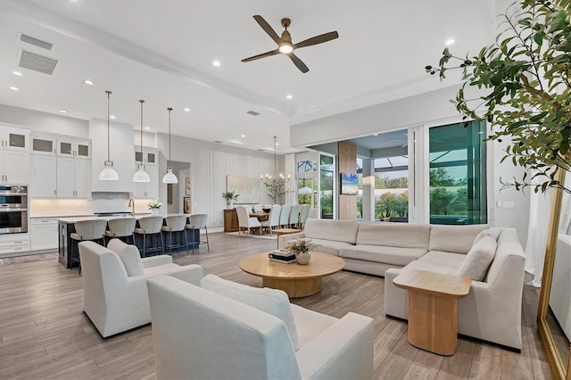 8209 Redonda Loop, Lakewood Ranch, FL 34202 - living room with a ceiling fan, light wood-style flooring, and recessed lighting
