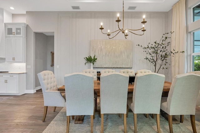 8209 Redonda Loop, Lakewood Ranch, FL 34202 - dining area featuring wood finished floors and a chandelier