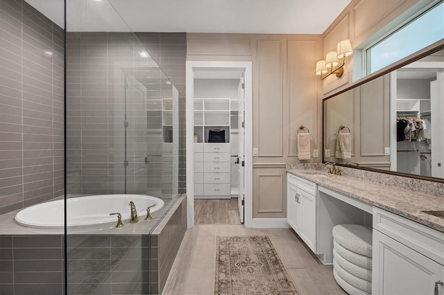 8209 Redonda Loop, Lakewood Ranch, FL 34202 - full bathroom with vanity, a spacious closet, and a bath